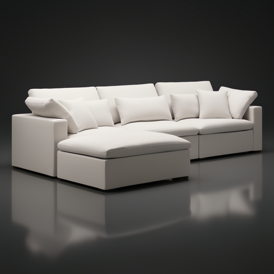 Surya Avington Ottoman in charcoal linen-polyester, paired with a matching sectional, on a dark reflective surface.