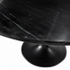 Close-up of a round Surya Anatalia dining table with a black polished marble top and black iron base.