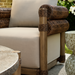 Surya Porta Swivel Chair with beige Sunbrella cushions, brown handwoven PE wicker, and aluminum base.