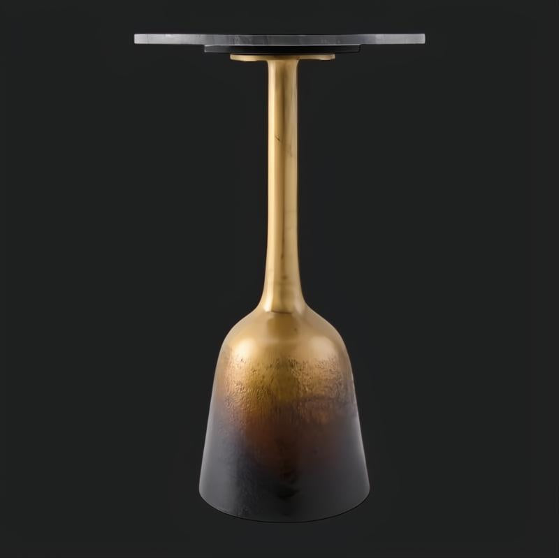 Surya Alva end table with a black marble top and a metallic bronze iron base featuring an ombre finish.