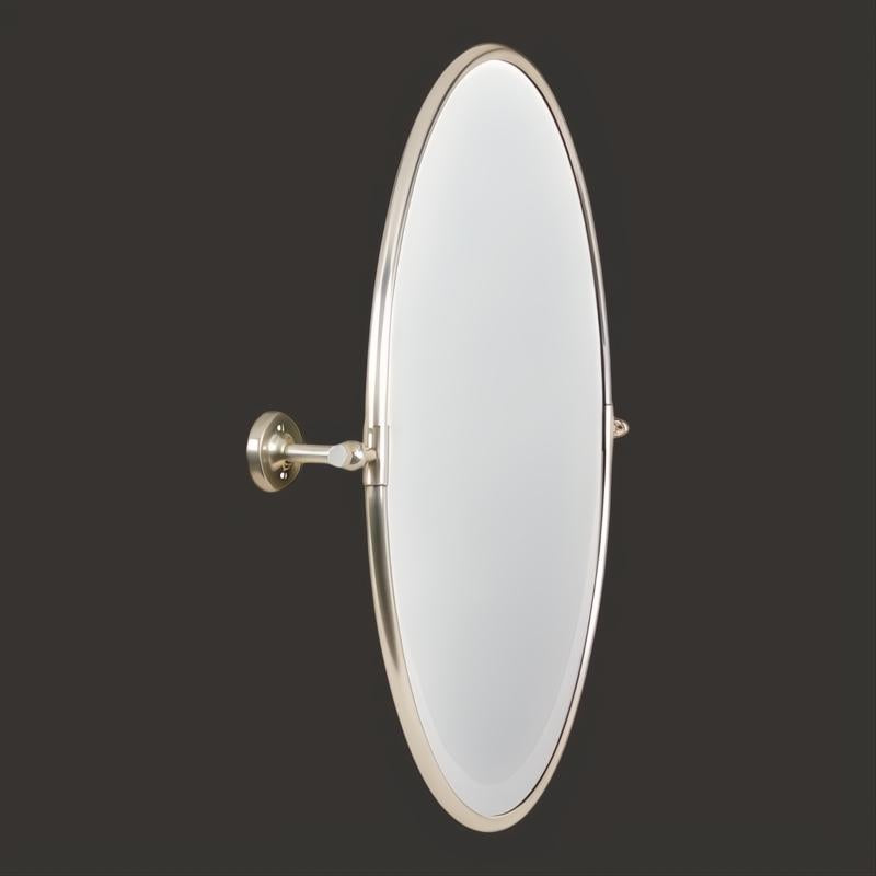 Surya Burnish oval wall mirror with an antiqued metallic silver brass frame, vertically mounted.