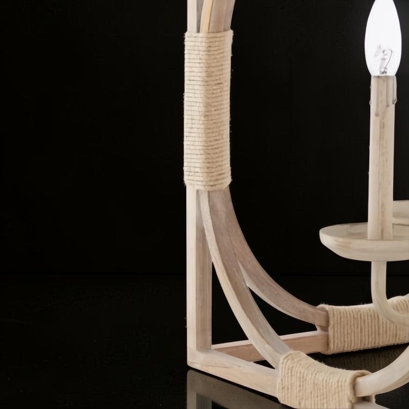 Close-up of Surya Braylee 4-light chandelier with light wood frame and rope-wrapped accents.