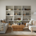 Surya Arquette 40" x 40" square coffee table in natural wood veneer, centered in a modern living room.