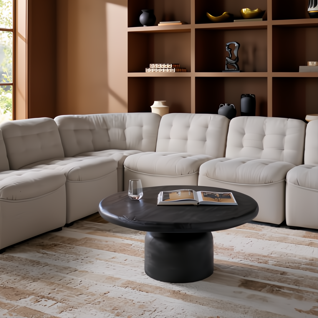 Light beige modular sofa with tufted cushions in a modern living room.