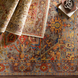 Hand-knotted Surya Cappadocia wool rug with intricate patterns in dusty sage, mauve, blue, mustard, and olive.
