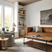 Surya Mohave Pouf: A textured, beige bouclé pouf with polybead filling, nestled in a cozy farmhouse living room.