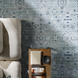 Surya Almeria ALM2302 hand-knotted low pile area rug in multi-tone denim, black, and dusty sage.