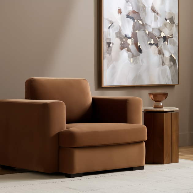 Modern Surya Cahill accent chair in rich brown polyester with a charcoal base, next to a wood side table.