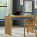 Surya Helene console table: brown oak veneer with blue grasscloth drawers, brass knobs, and a clean rectangular profile.