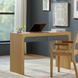 Surya Helene console table: brown oak veneer with blue grasscloth drawers, brass knobs, and a clean rectangular profile.