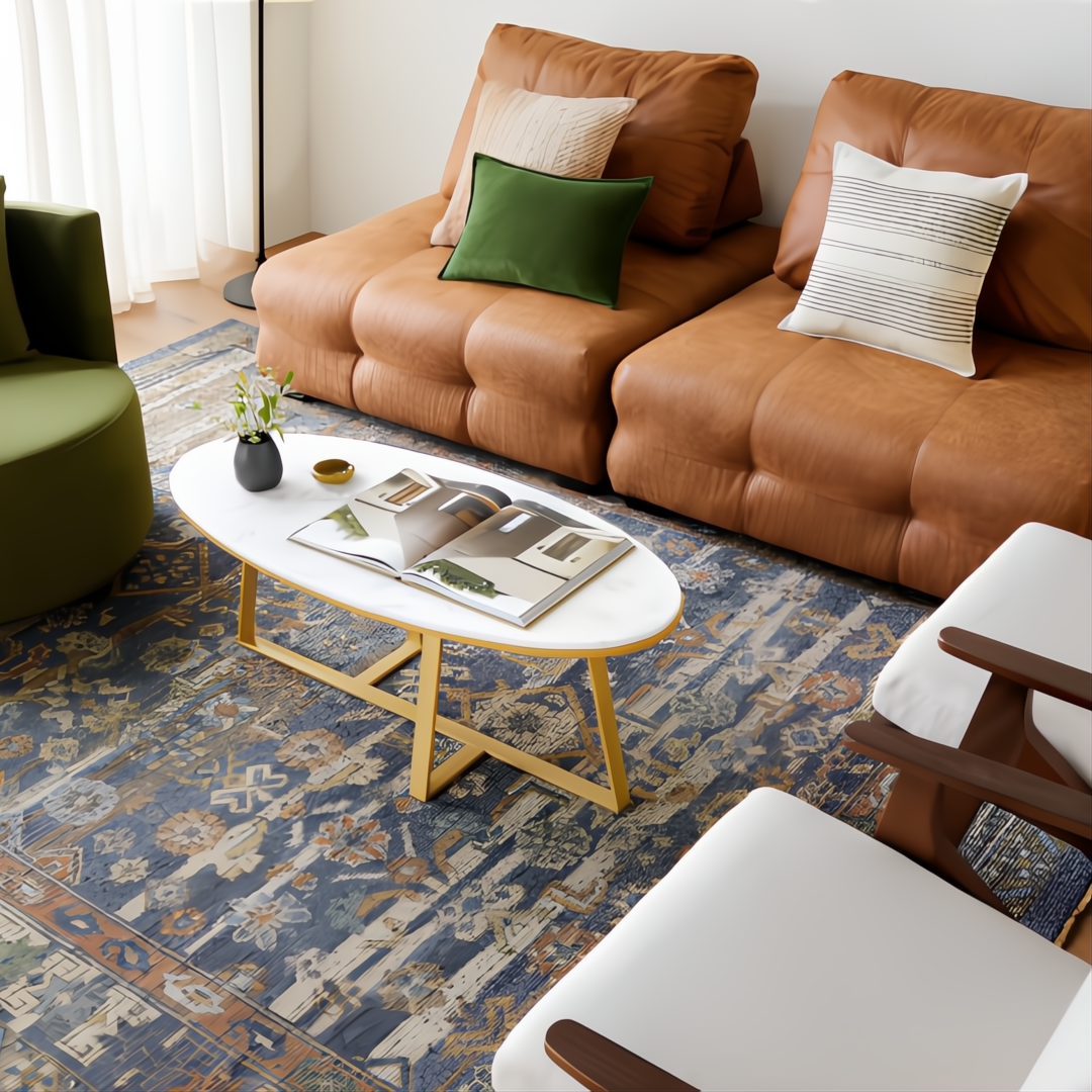Surya Akola oval coffee table with white marble top and gold base in a modern living room.