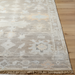 Surya Antalya AAT-2301 transitional wool area rug with muted beige, cream, and subtle peach tones.