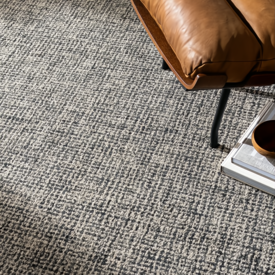 Surya Aiden wool area rug in Ink Blue and Charcoal with a textured, medium pile design.