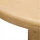 Close-up of a round beige mango wood coffee table with a brushed finish.