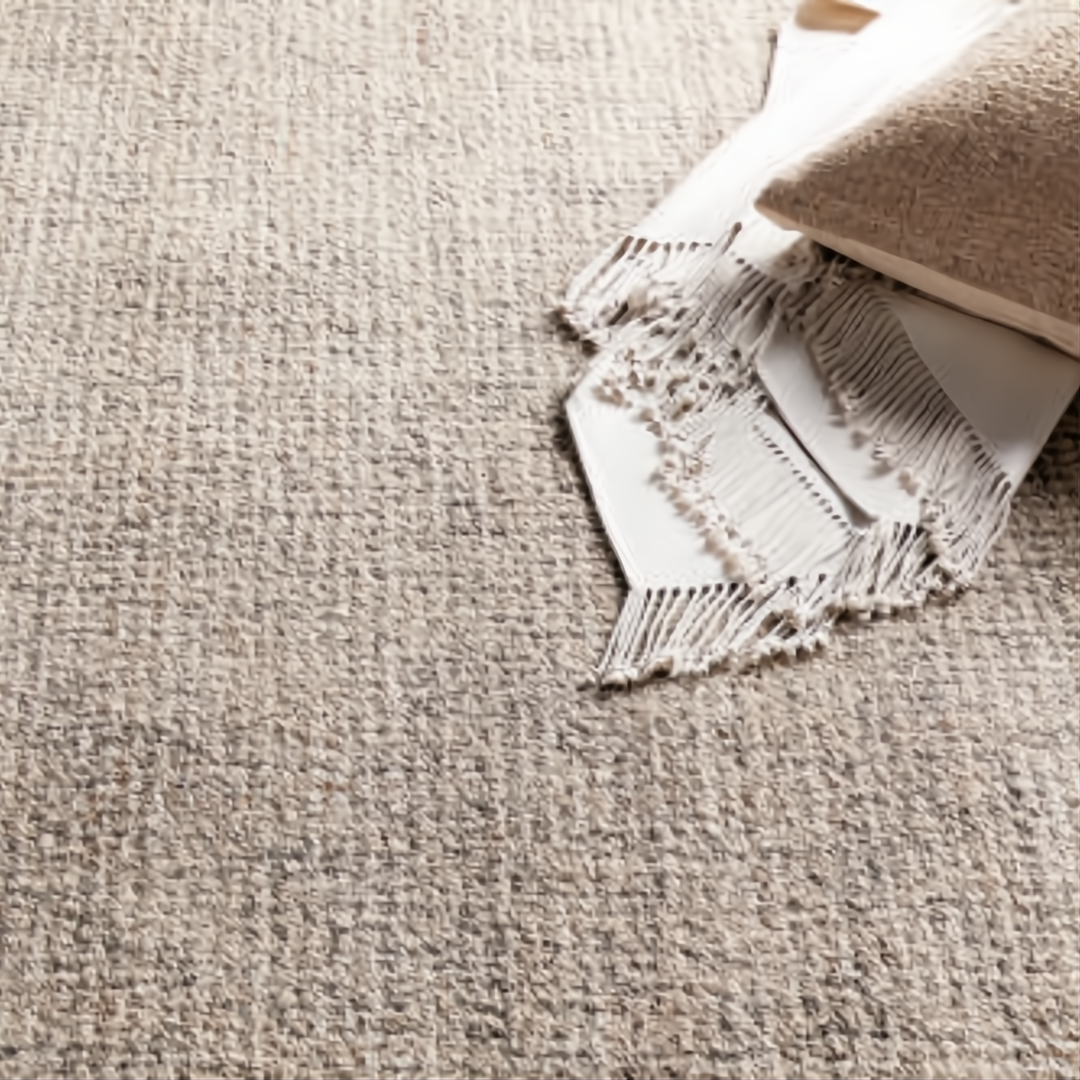 Surya Aiden AEN-1005 medium pile wool area rug in gray and ivory, with a throw and pillow.