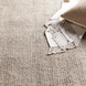 Surya Aiden AEN-1005 medium pile wool area rug in gray and ivory, with a throw and pillow.