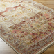 Hand-knotted Surya Cappadocia wool rug in traditional plum, gray, burgundy, and olive tones with fringe.