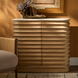 Beige lacquered mango wood Redondo cabinet with a polished marble top and minimalist modern design.