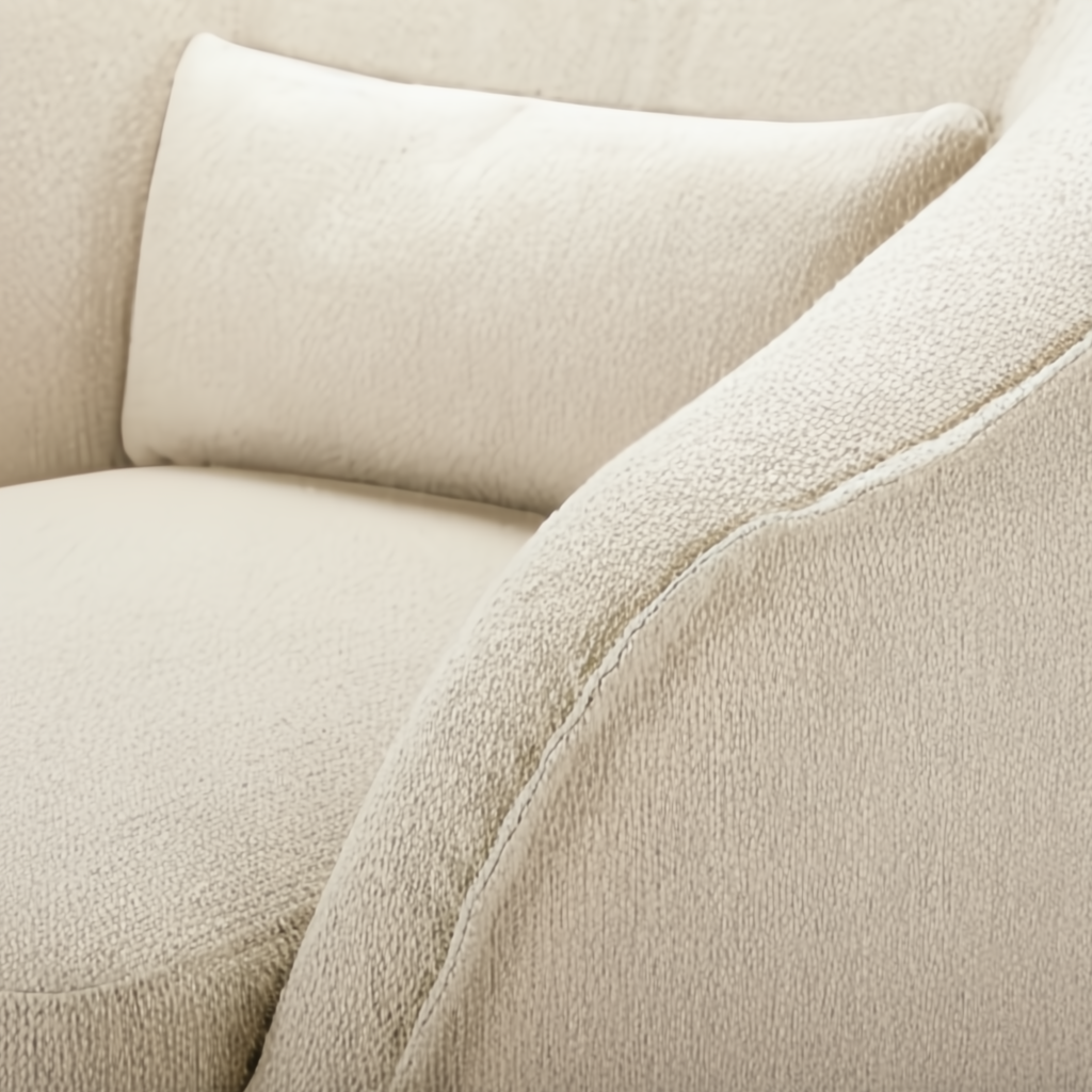 Close-up of a beige Surya Ariah swivel chair with textured polyester upholstery and a plush cushion.