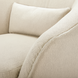 Close-up of a beige Surya Ariah swivel chair with textured polyester upholstery and a plush cushion.