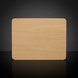 Close-up of a light brown oak veneer end table top with rounded corners.