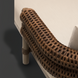 Brown handwoven PE wicker detail on a Surya Porta Daybed with a light Sunbrella® acrylic cushion.