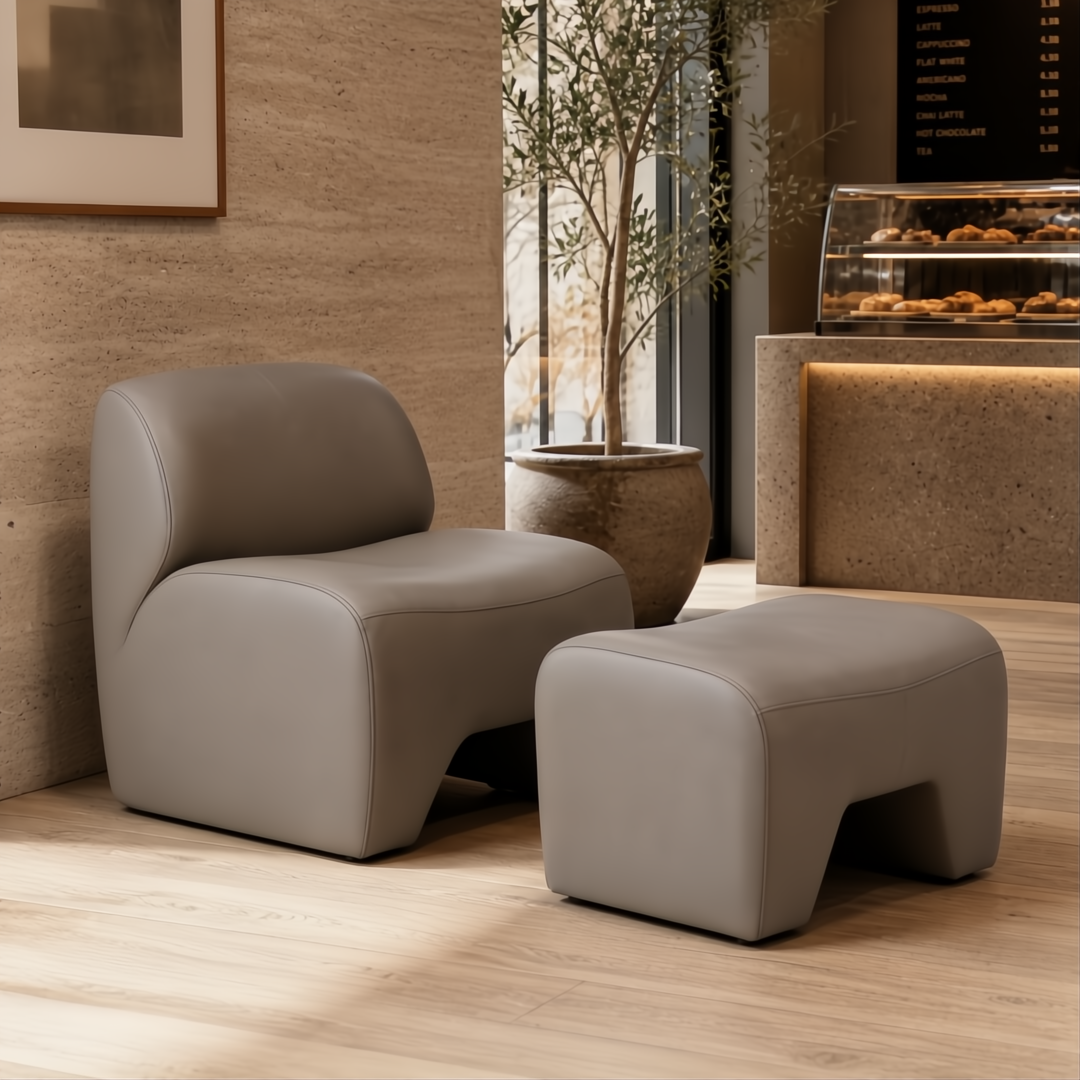 Surya Sable Accent Chair in taupe, mocha, sandstone with cushioned seating and matching ottoman.