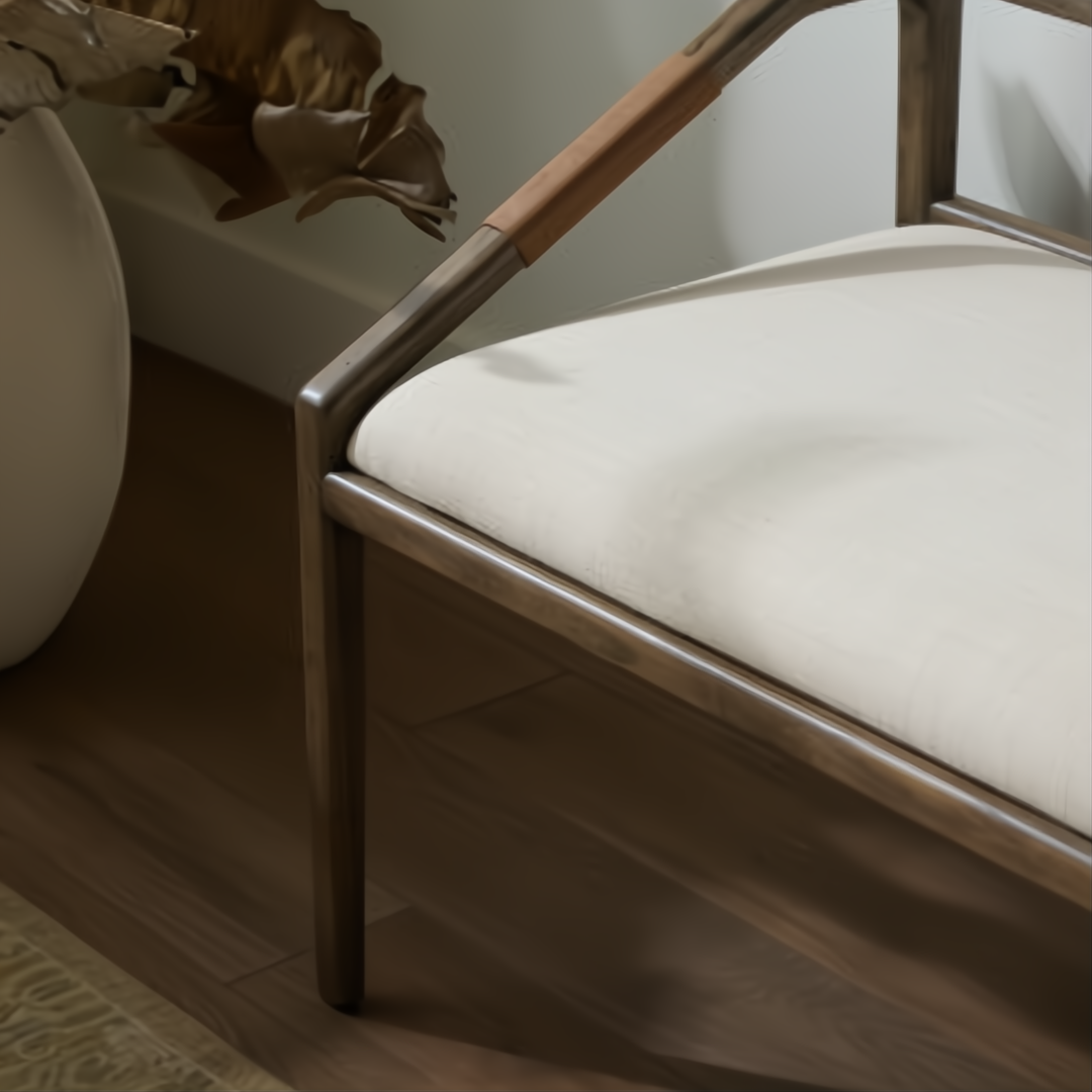 Surya Atra Bench with light beige upholstered seat, brown red oak frame, and leather cord wrap detail.