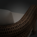 Brown wicker Surya Porta Accent Chair with light Sunbrella® cushion, suitable for outdoor use.