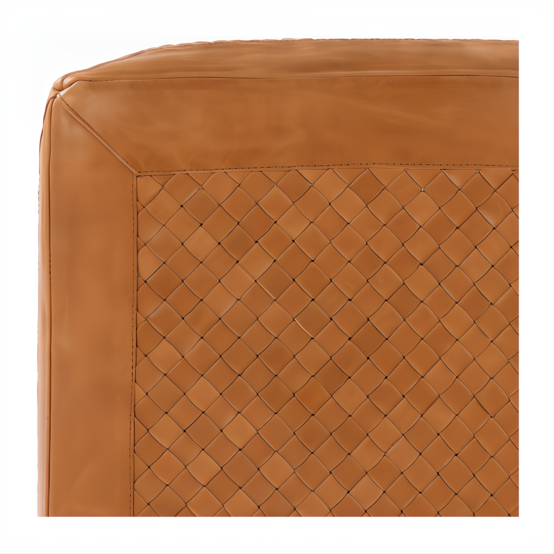 Close-up of a Surya Lawdon ottoman, featuring a brown woven leather top with stitched trim.