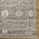 Surya Almeria hand-knotted low pile area rug in light brown, gray, and cream with fringe.