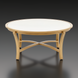 Round Surya Cape Town coffee table with a light beige stone top and wheat-colored aluminum base.