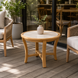 Surya Cape Town 24" round beige stone and aluminum end table with wood-look base.