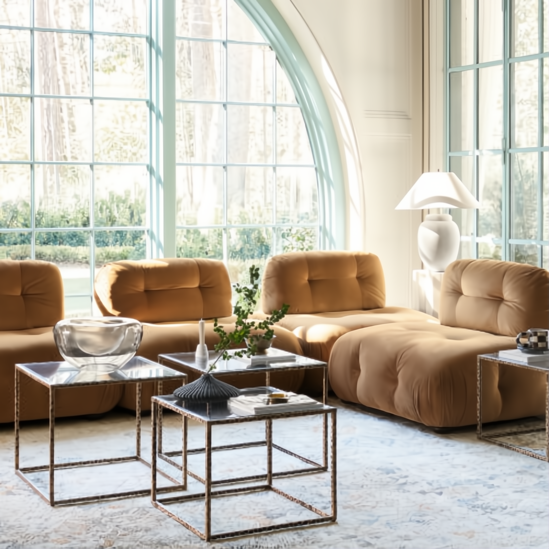 Surya Capelli Accent Table Lamp with a white ceramic base and fabric shade in a living room.