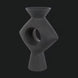 Surya Yagya YAG-008 black brushed matte ceramic vase with a sleek sculptural silhouette and central cutout.