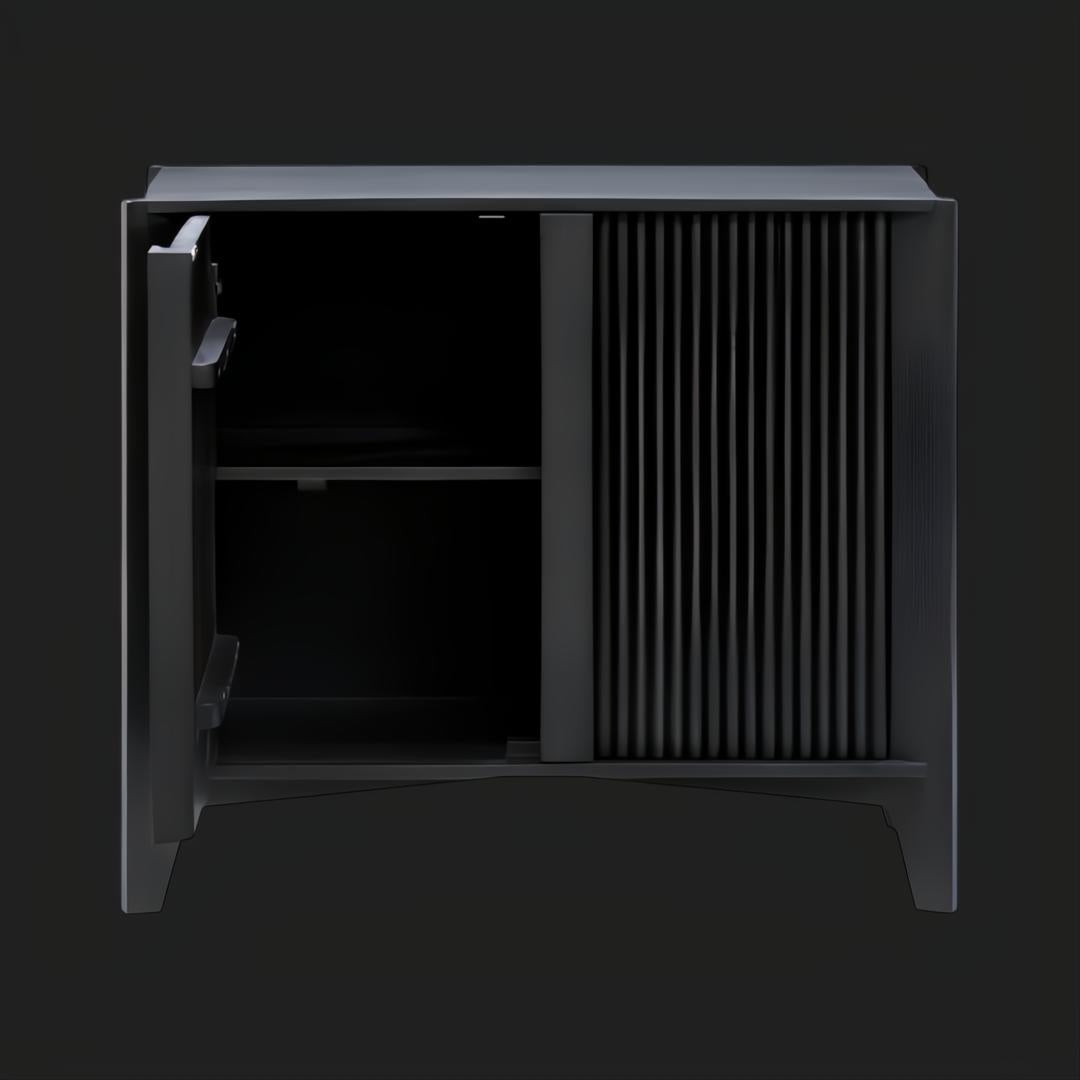 Black mango wood Surya Ronan cabinet with a ribbed door and an open soft-close door revealing an adjustable shelf.
