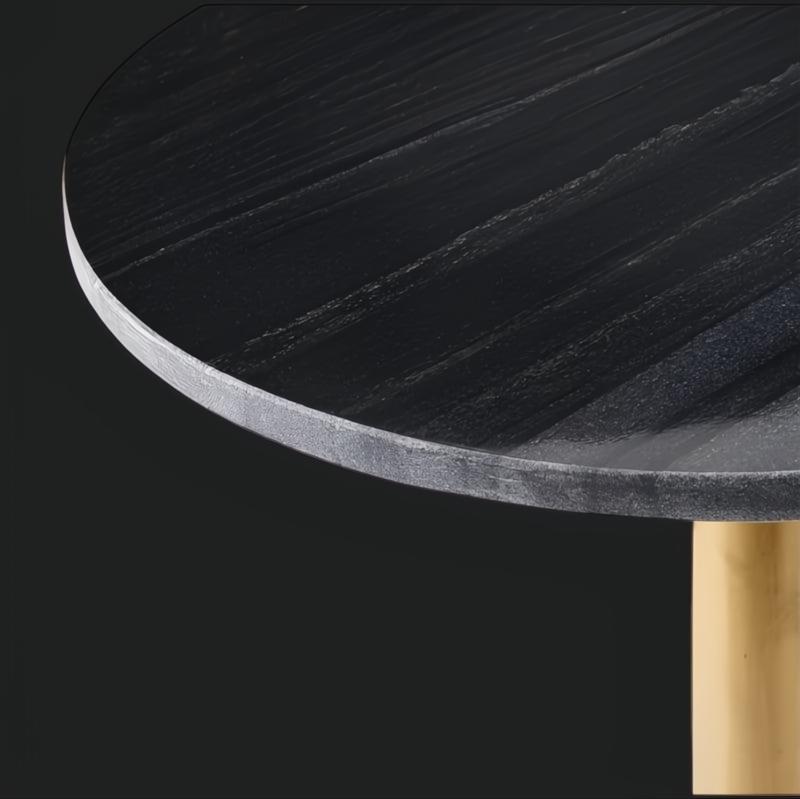 Surya Alva end table with a black marble top and metallic bronze iron base.