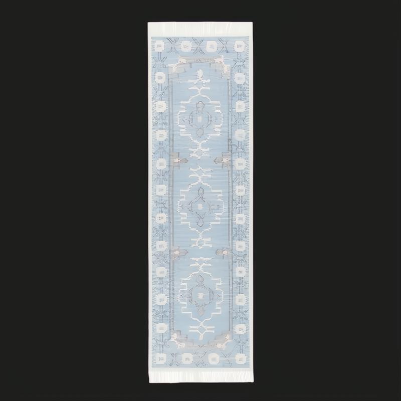 Light blue Surya Burano runner rug with white fringe and geometric patterns, made from recycled PET yarn.