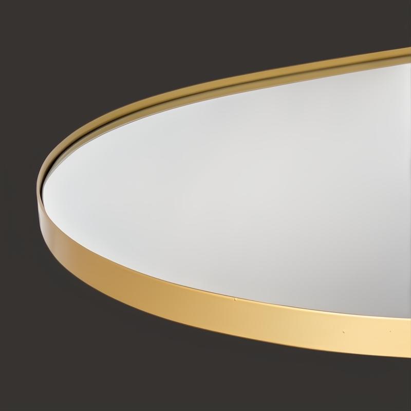 Close-up of Surya Aamnah AMH-001 rectangular wall mirror with a sleek gold iron frame.