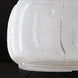 Close-up of Surya Bentley accent table lamp base, featuring clear seeded glass on a black surface.
