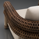 Surya Porta Swivel Chair with handwoven brown PE wicker and light beige Sunbrella cushions.