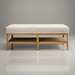 Surya Landi Bench with light beige upholstered top, natural rubber wood frame, and woven brown storage shelf.