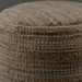 Camel Surya Denpasar pouf with woven jute and cotton top, raw edge detail, and polybead fill.