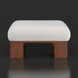 White polyester Lunara ottoman with a rounded top and sturdy brown rubber wood base.