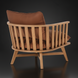 Surya Arco accent chair with a brown leather cushion and natural beechwood slatted back.
