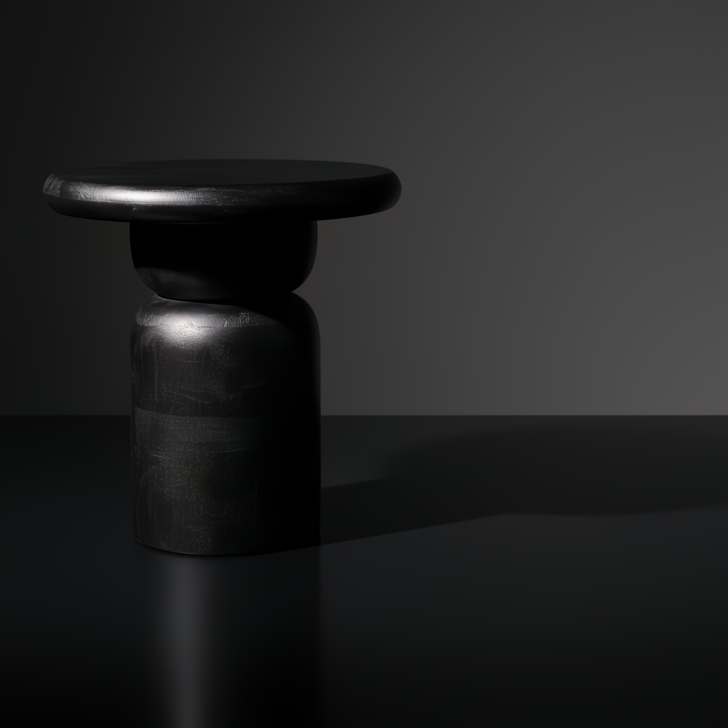 Surya Koben black mango wood end table with a compact round top and turned base.