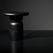 Surya Koben black mango wood end table with a compact round top and turned base.