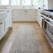 Surya Hope HOP-2300-P hand-loomed runner rug in neutral multi-tone recycled PET yarn, on a light wood kitchen floor.