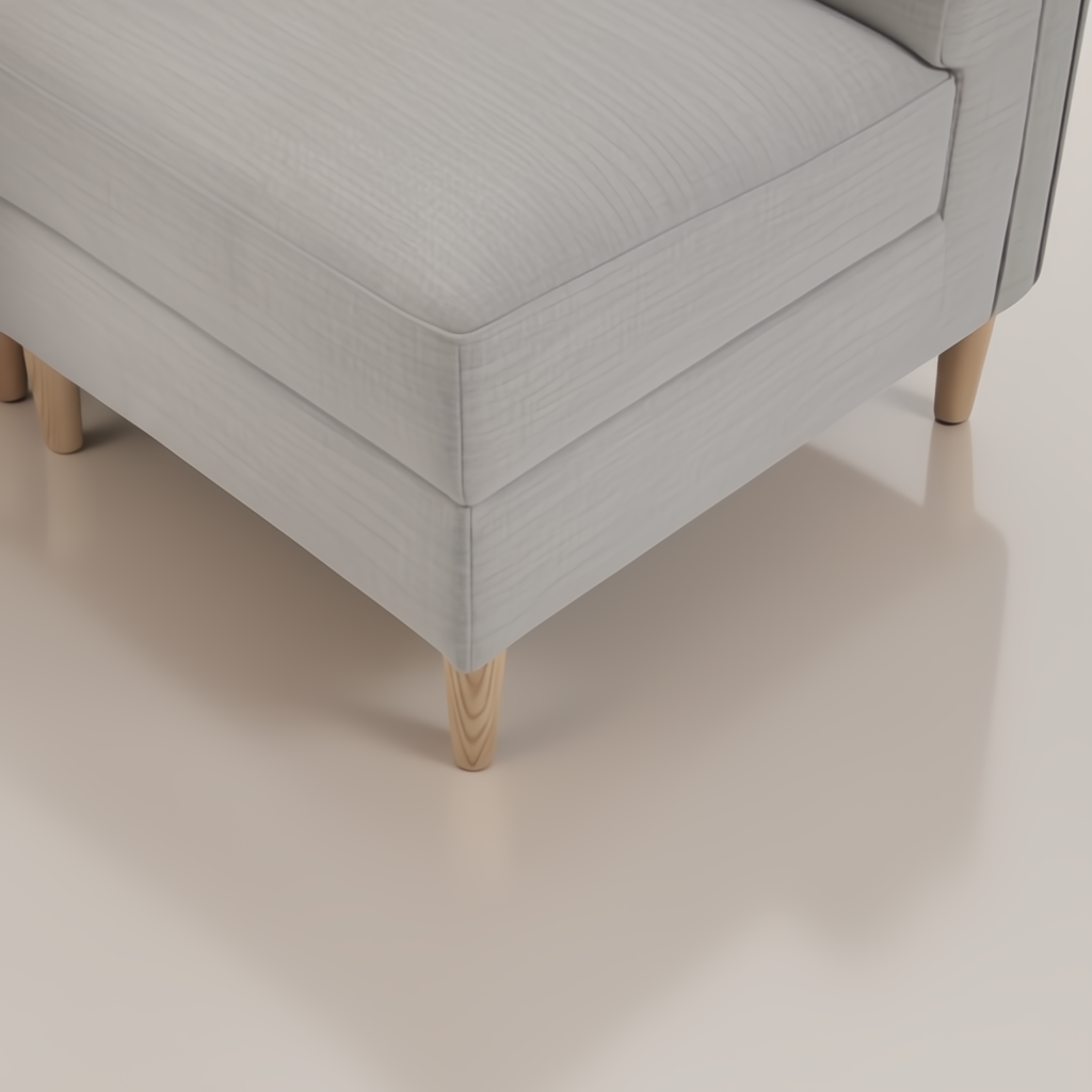 Light gray upholstered banquette chair with natural ash wood legs and side cut-out detail.