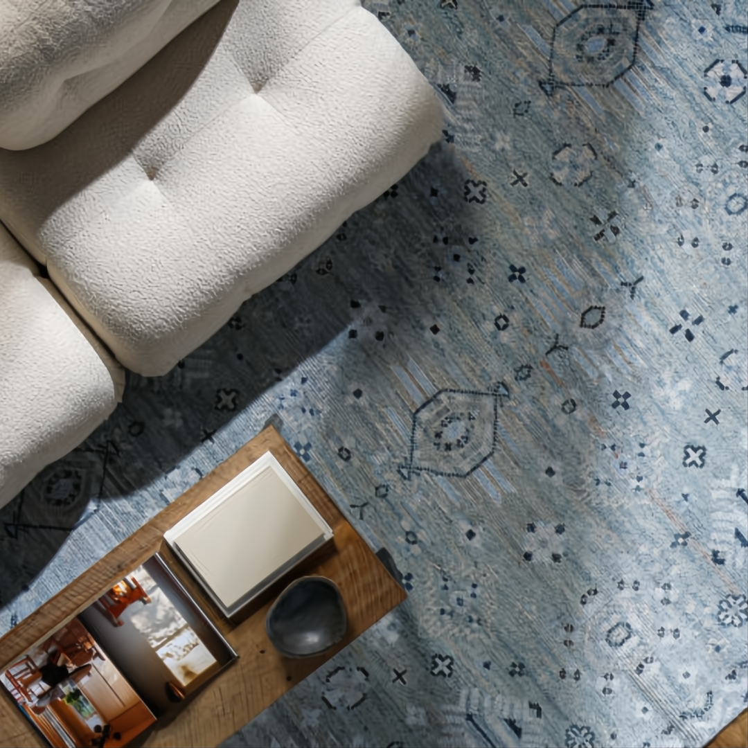 Hand-knotted Surya Almeria ALM2302 low pile area rug in multi-tone Denim, Black, Dusty Sage, and Cream.
